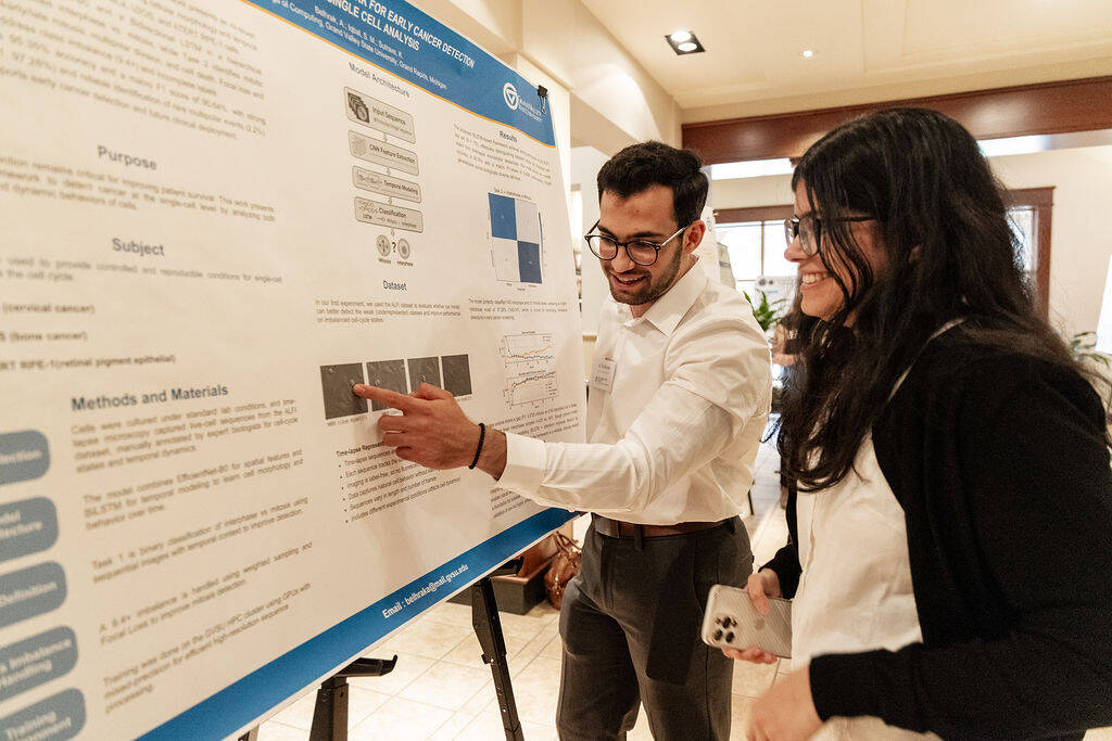 Participant pointing at poster